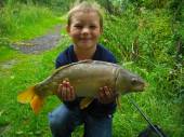This is 8 year old Brandon Steel with two of the cracking fish he caught on his first trip to Bullock Farm.  Brandon used 16mm pineapple pellet over a bed of scopex sweetcorn from peg 1 of the Carp Lake.  This fish weighed in at 8lb 4oz.