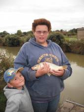 Rachael  Glew aged 14yrs with a 1 1/2lb carp caught on luncheon meat.
