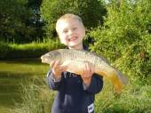 This is 5 year old Harry Parfitt from Yatton with his first fish, a lovely common carp from Rushcombe lake caught on softened pellet and a shortened pole.  Harry nick-named the fish 'Big bad Barry'!