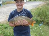 This is Luke Nix with the largest fish caught from Rushcombe Lake so far!  Luke caught this lovely 10lb common carp on the pole with a size 16 hook and luncheon meat from the margins of peg 5.  Luke finished up with a 90lb bag of fish.  