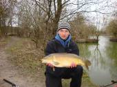 This is Rafal Rybarczyk with a beautiful 11lb carp caught with corn on the hook from the Match Lake.