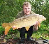 This is Ricky Seery with a lovely 12.6lb common from the Carp Lake.