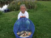 This is 7 year old Rosie who managed to bag 30lb of fish from Rushcombe Lake on her first attempt.  She was helped by her Grandad, Bill Davis.