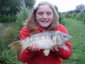 This is Sarah Page with her biggest ever fish caught from the Hovis pegs on the North Pool.  It took her 15 minutes to land it.