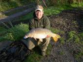 Shaun Collins a Field Service Engineer from Bradley Stoke, caught this beautiful 14.5lb mirror on 23rd October 2007 using a piece of cubed bacon grill from peg 4 of the Carp Lake in the margins.